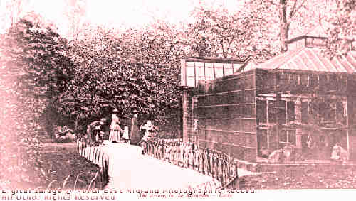 Glass house structure not shown in other photos of the aviary